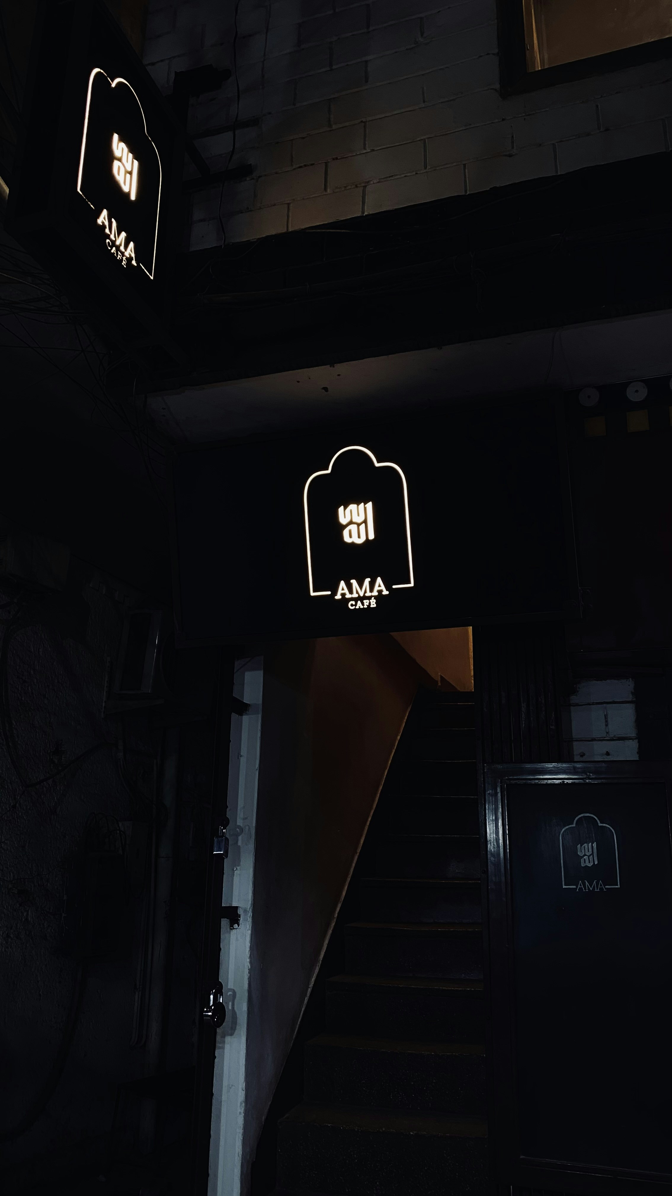 a couple of lights that are on the side of a building