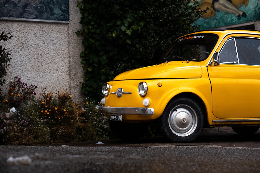 a yellow car parked in front of a building