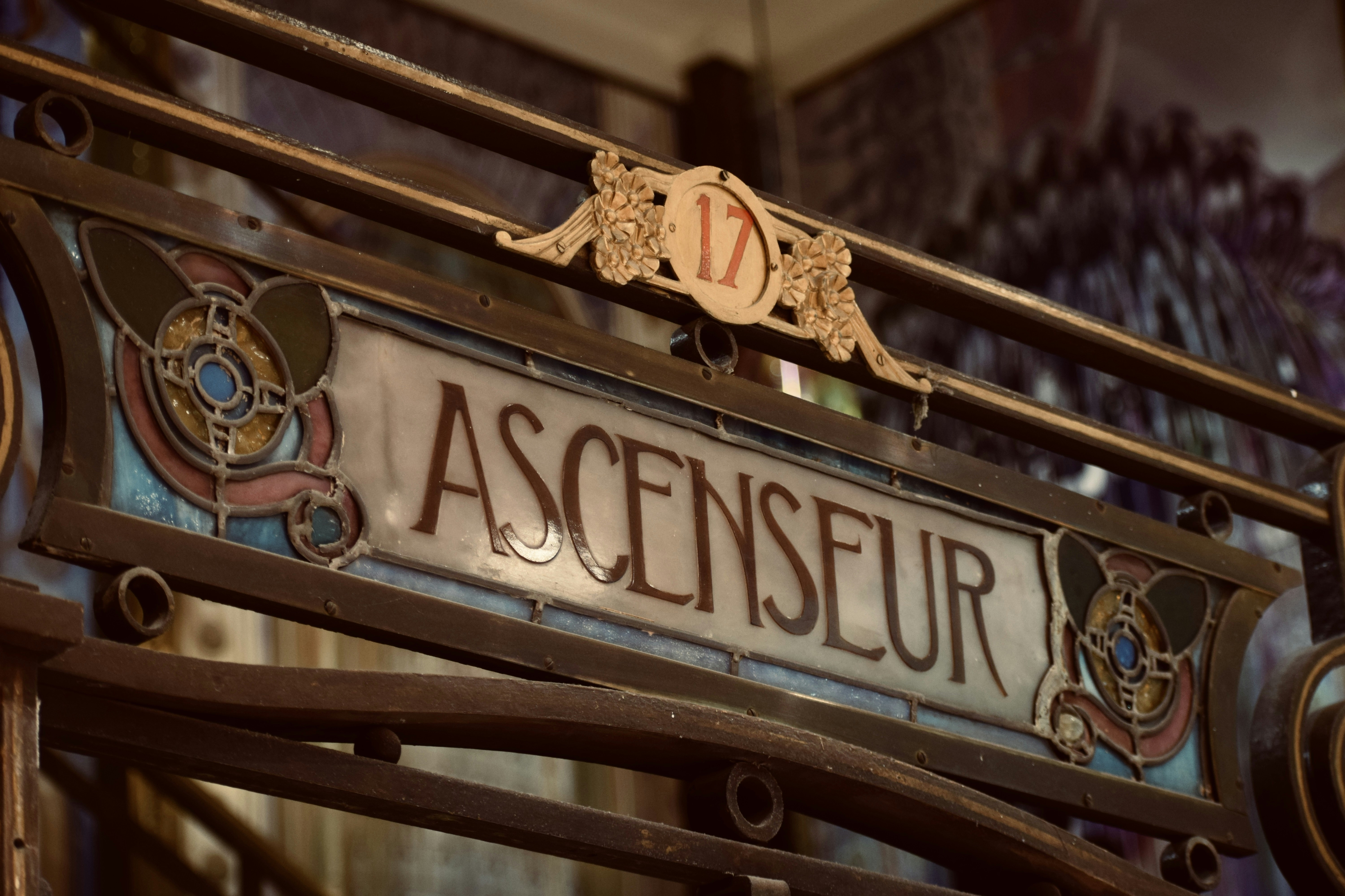 a close up of a sign on a metal fence
