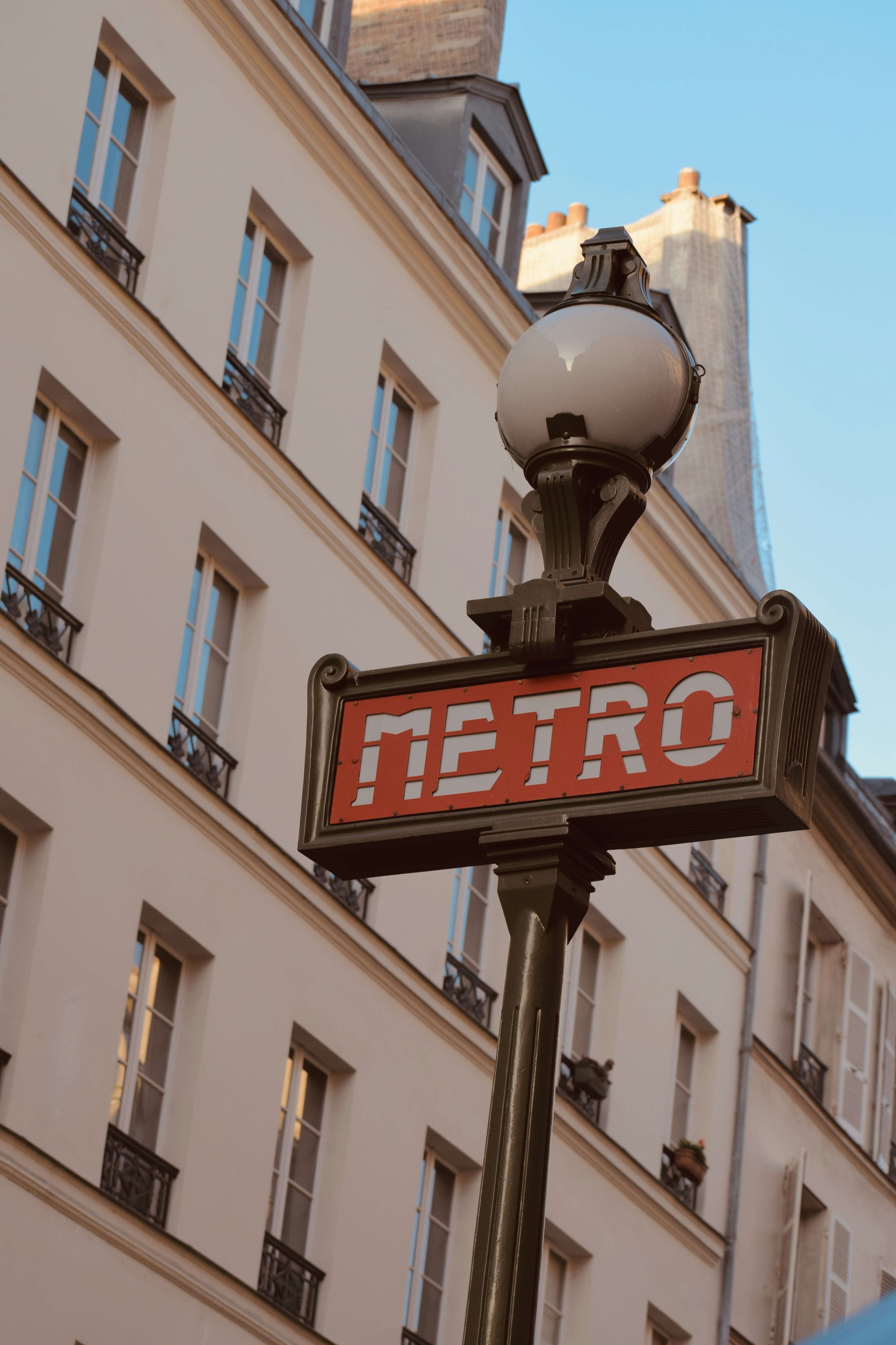 a street sign with a building in the background