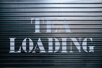 a sign that says it is loading on a garage door