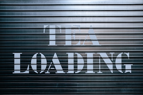 a sign that says it is loading on a garage door