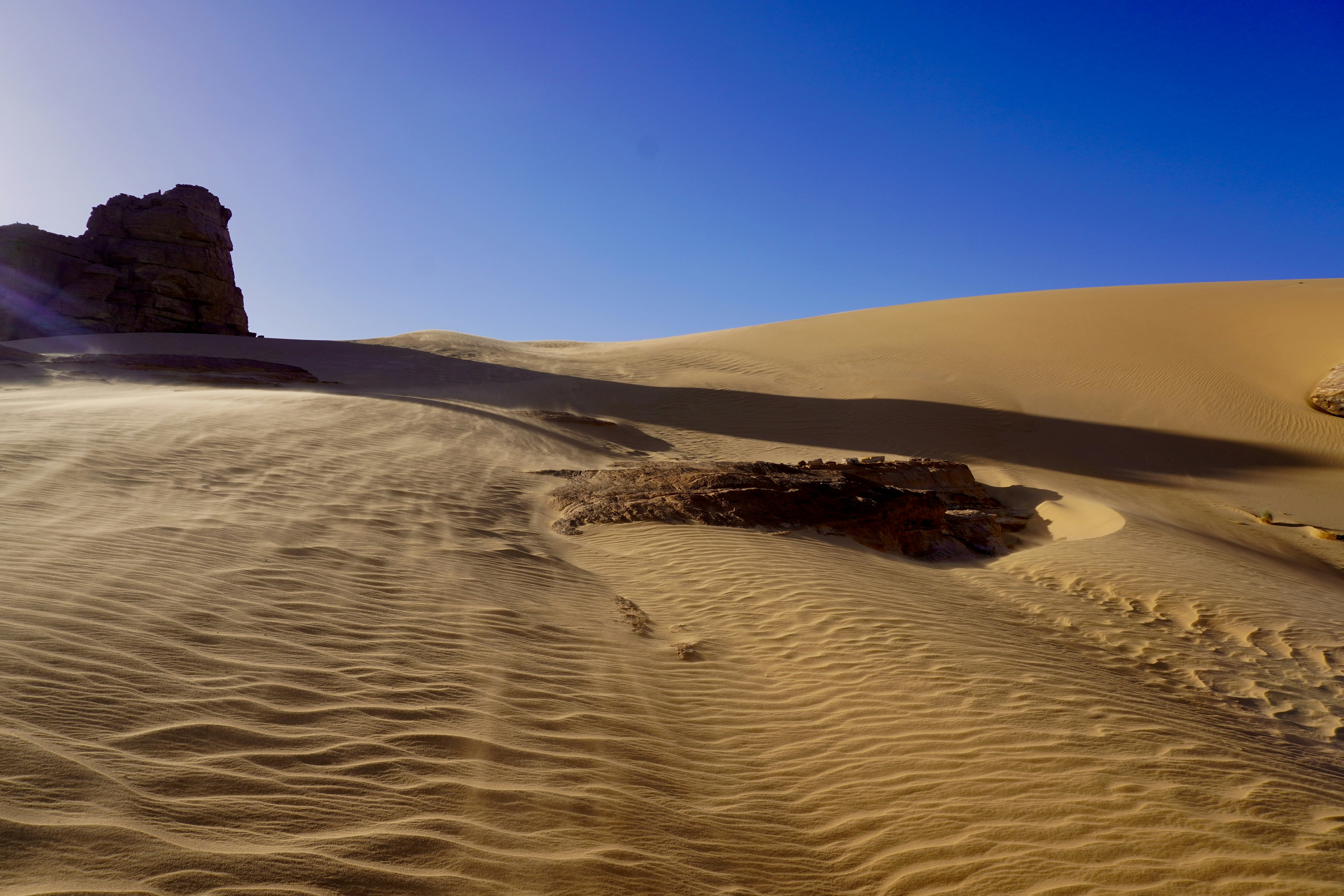 Tamanrasset, Algeria - Next to the kissing camels, the desert sand blows through Tin Akachakar (Algerian Sahara, N'Ahaggar National Park)