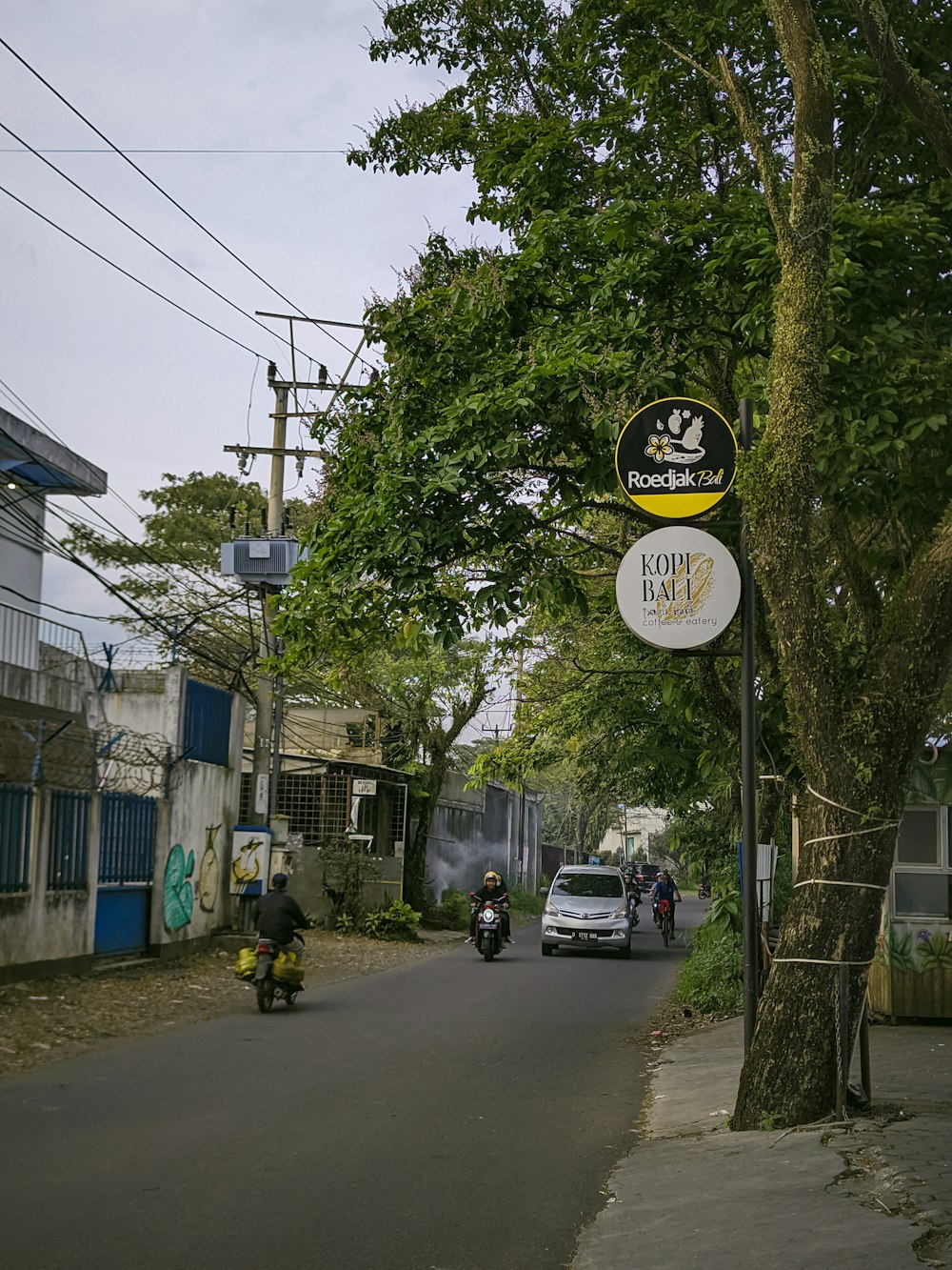 a street sign on a pole on the side of a road