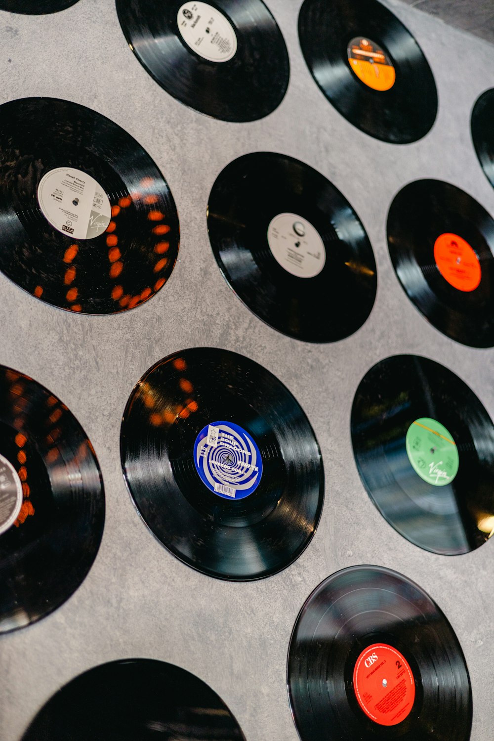 a collection of record records on a wall