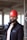 a man wearing a red hard hat and jacket