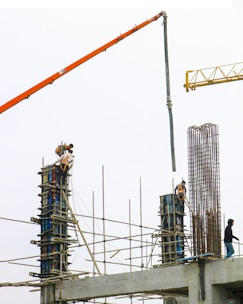 a man standing on top of a building under construction