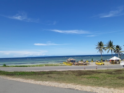A scenic view of North Goa’s beaches with a tour vehicle nearby.