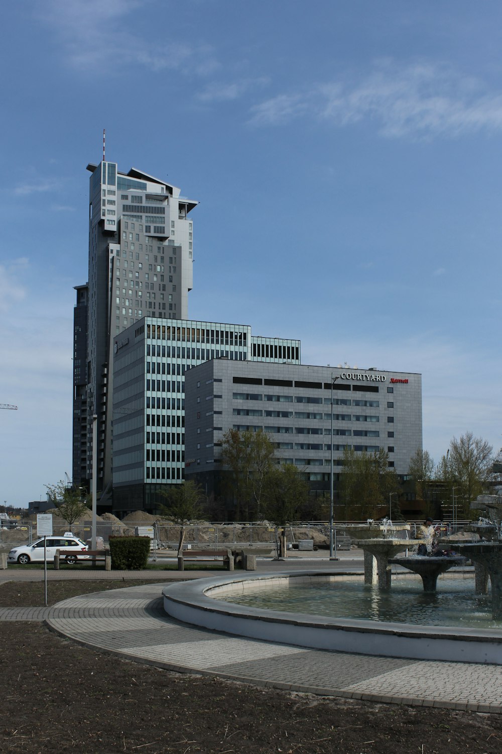 a large building with a fountain in front of it