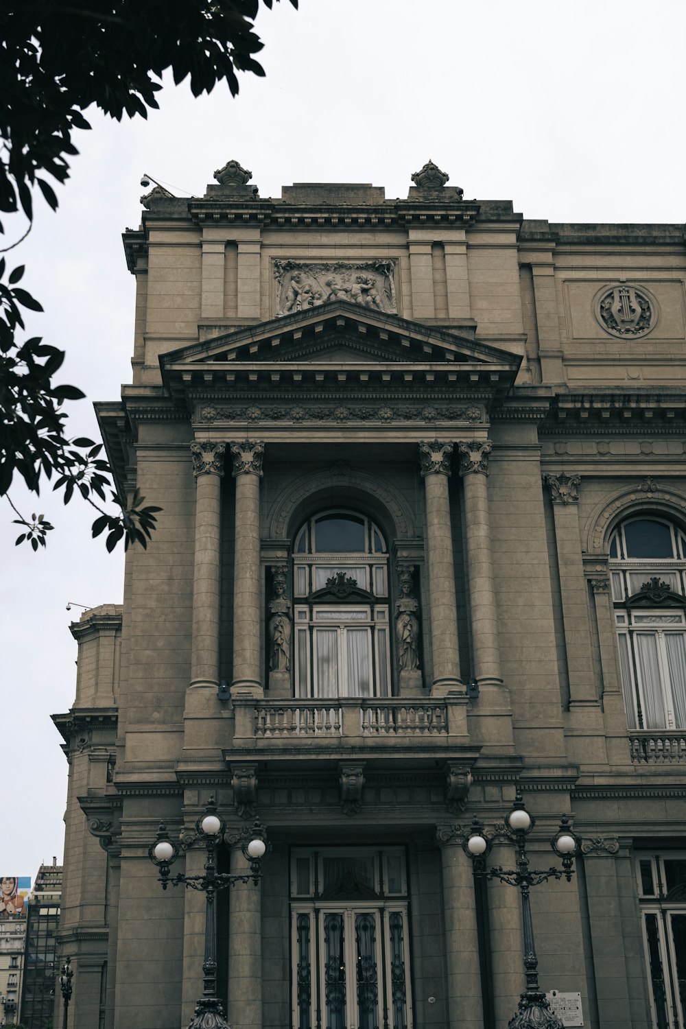 an old building with a clock on the front of it