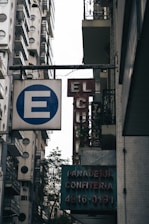 a street sign hanging off the side of a building