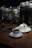 Close-up of a beautifully decorated Colombian cake and a steaming cup of coffee on a rustic table.
