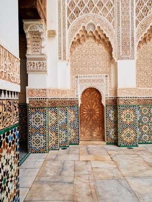 a doorway in a building with a tiled floor and walls