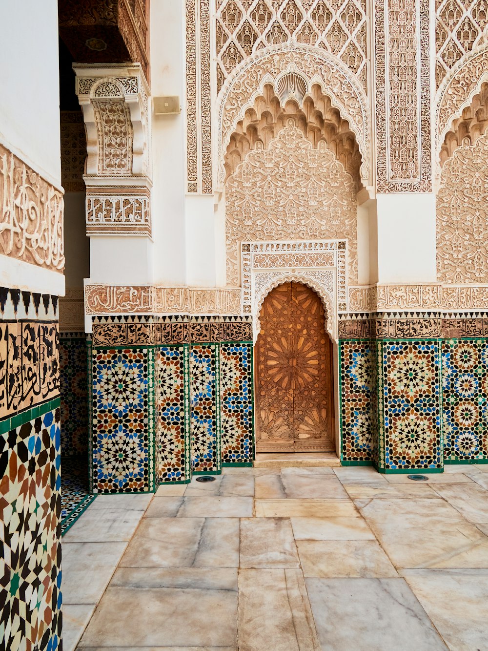 a doorway in a building with a tiled floor and walls