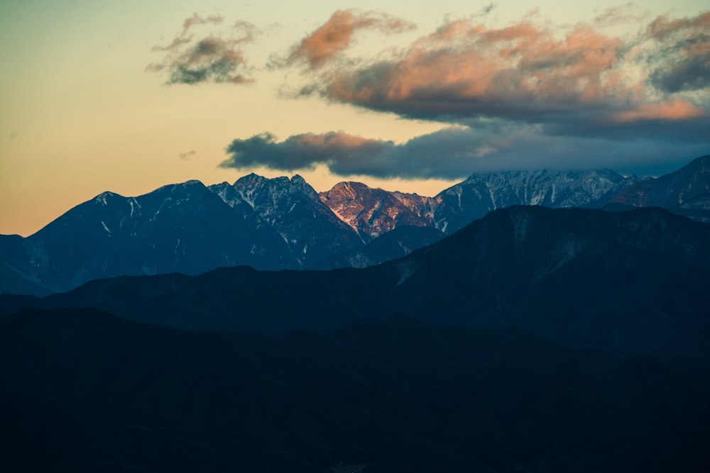 a view of a mountain range at sunset