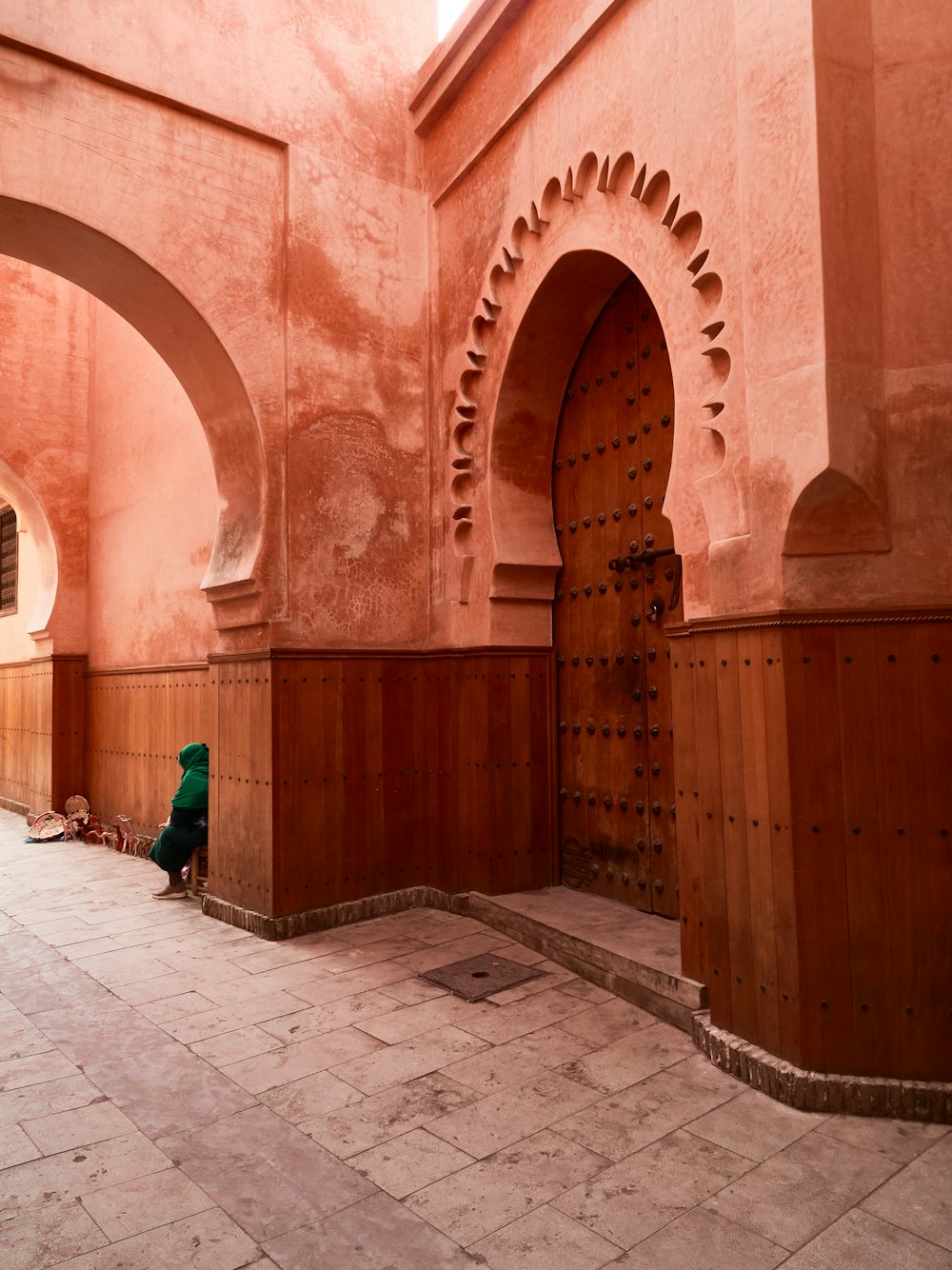 a person sitting on a bench in a building