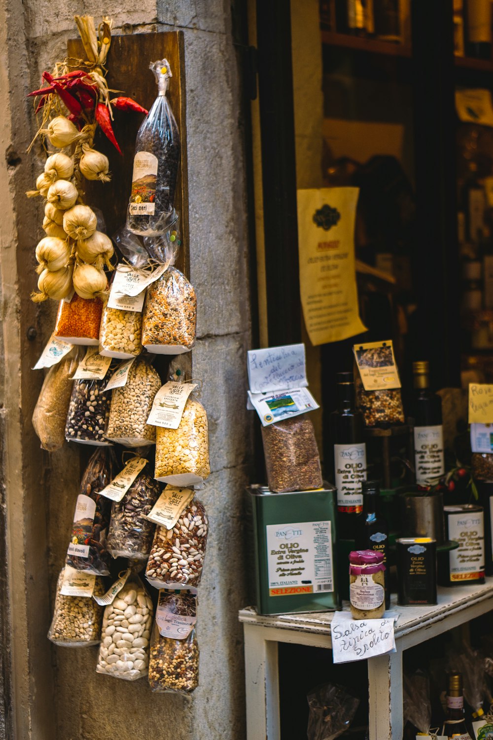 a bunch of food hanging on a wall