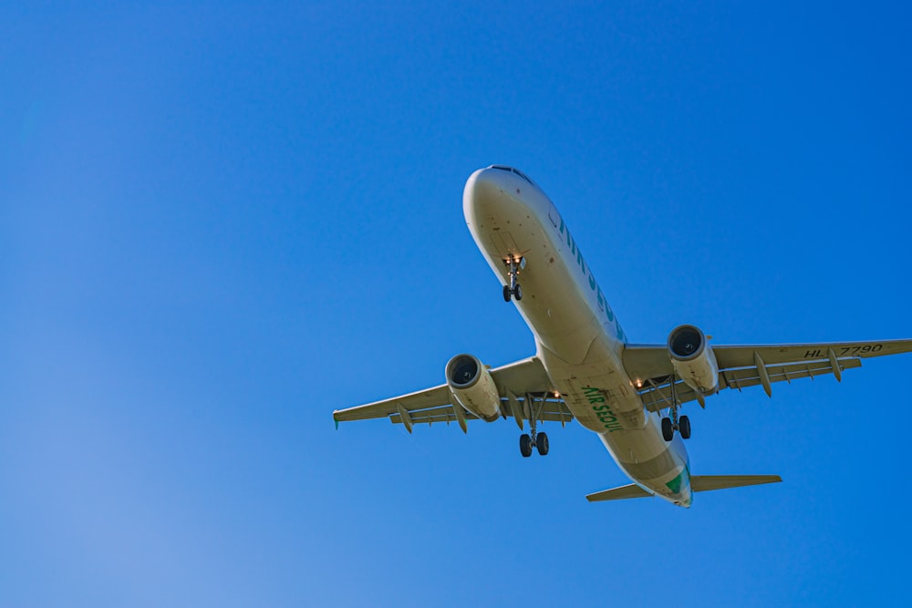 a large passenger jet flying through a blue sky