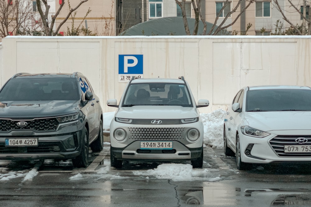 a group of cars parked in a parking lot