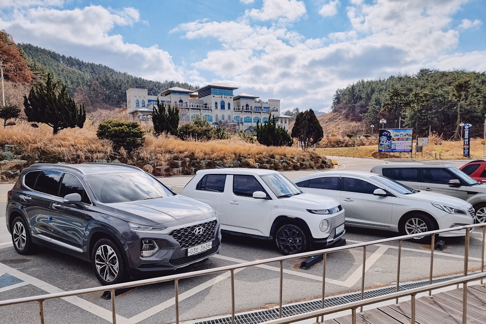 a group of cars parked in a parking lot