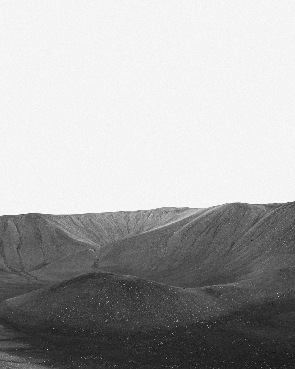 a black and white photo of a mountain range