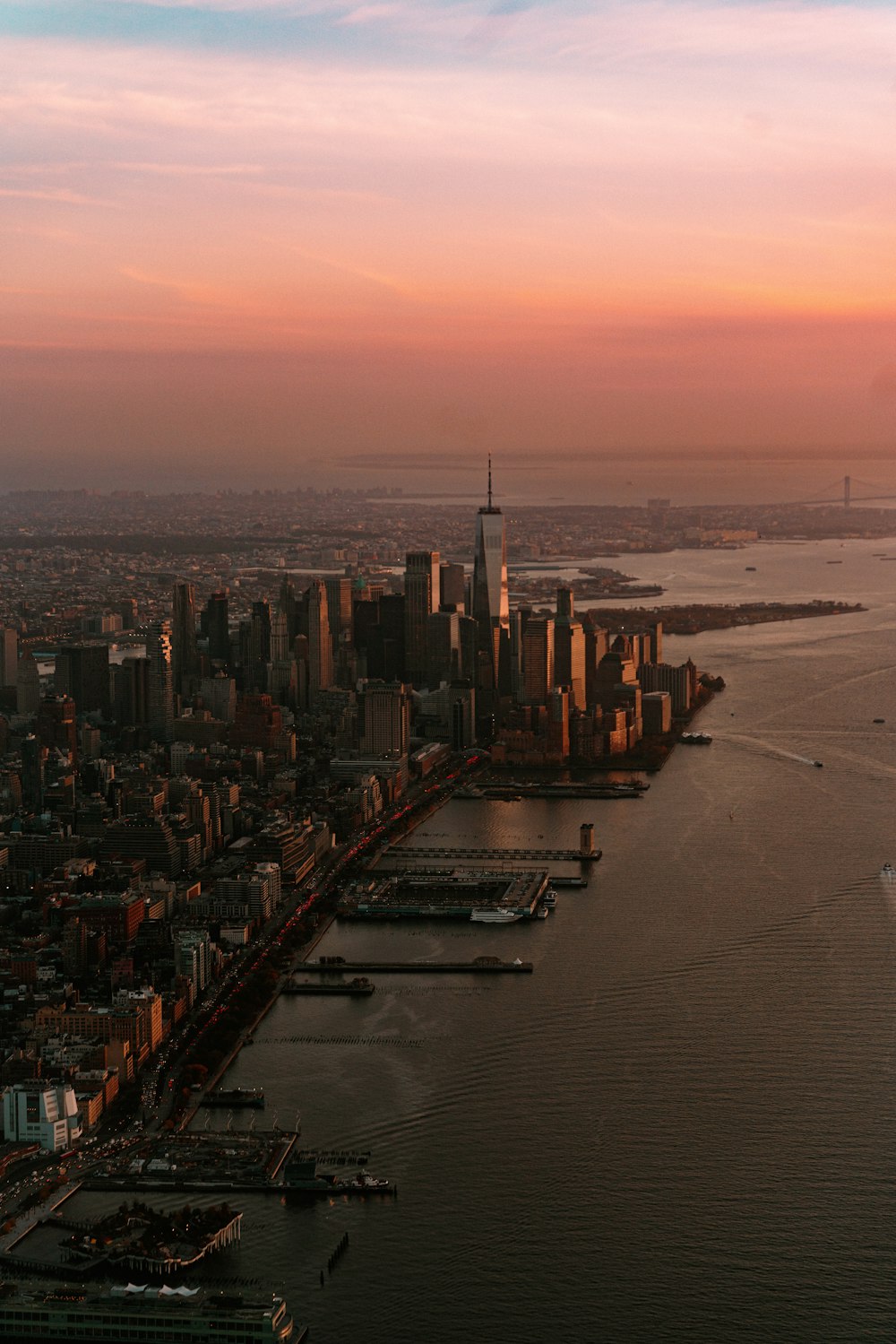 an aerial view of a city at sunset