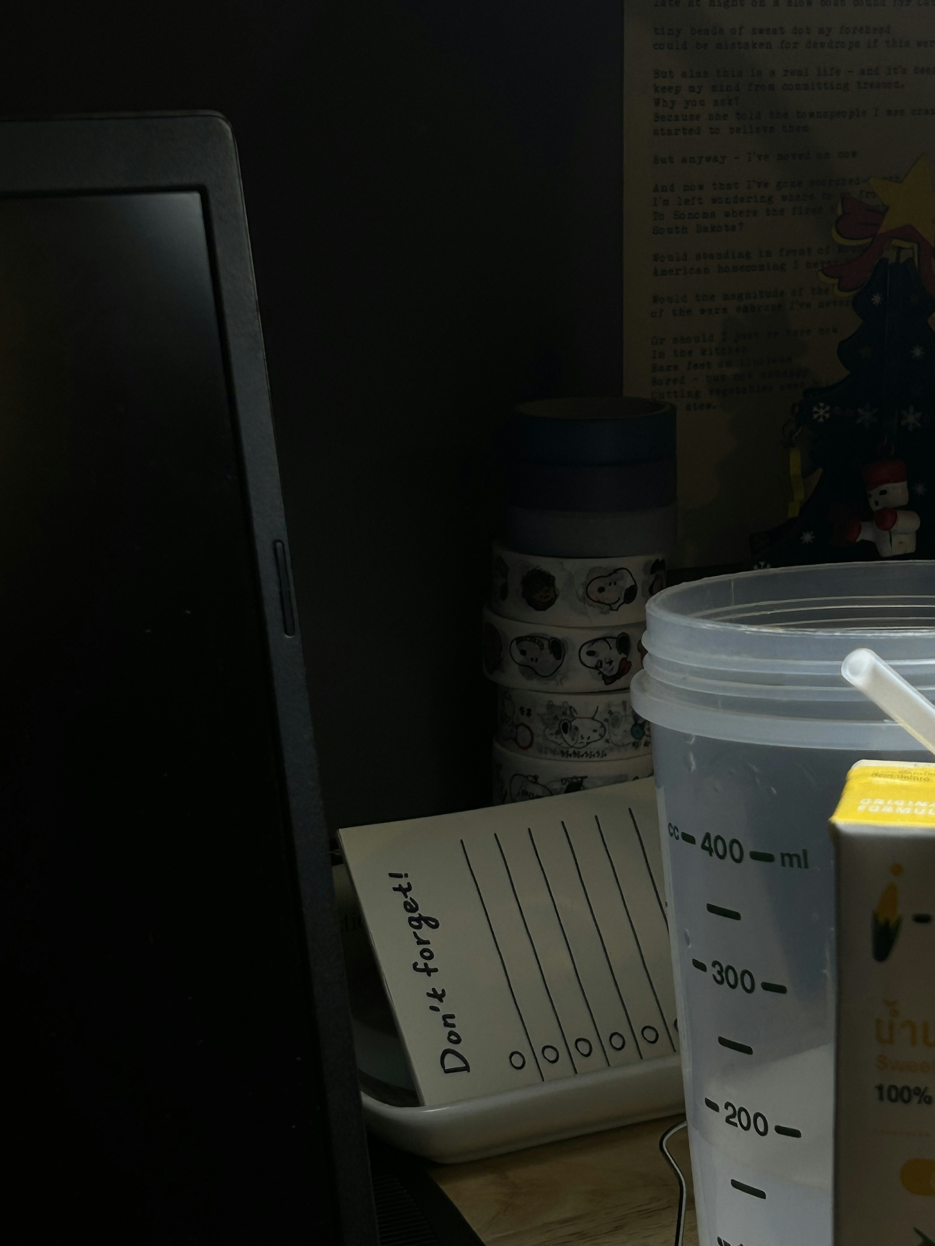 a cup of coffee sitting on a desk next to a computer