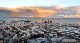 a view of a city with snow on the ground