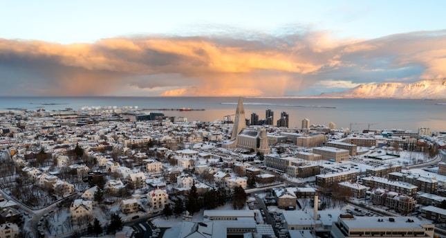 a view of a city with snow on the ground