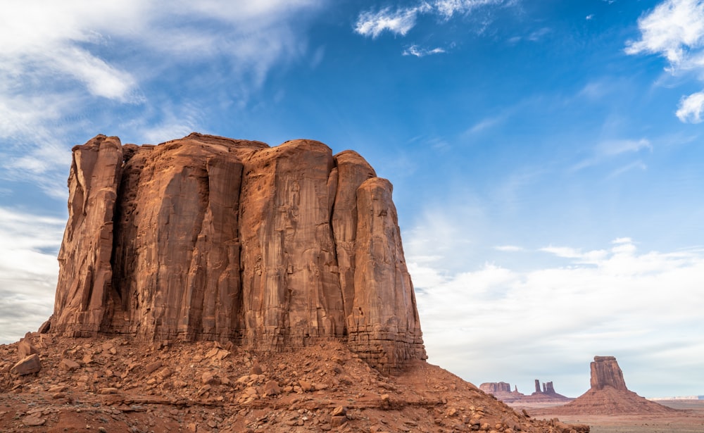 a large rock formation in the middle of a desert