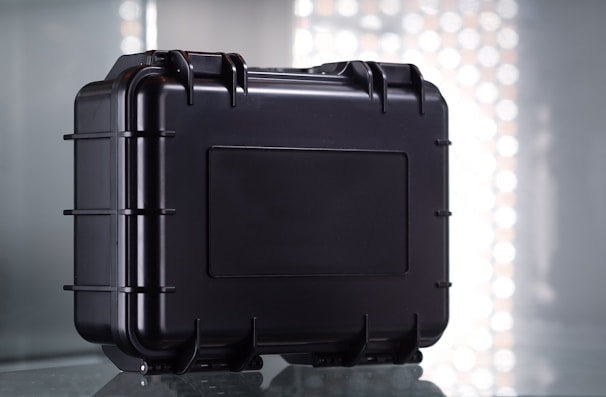A sturdy hard case positioned on a rugged surface.