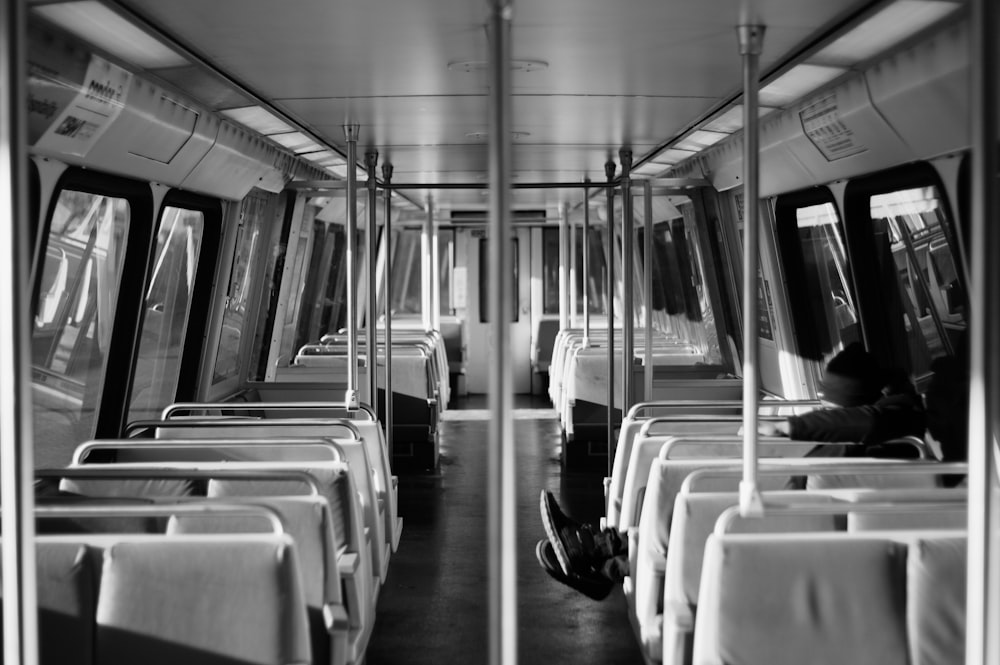 a black and white photo of a subway car