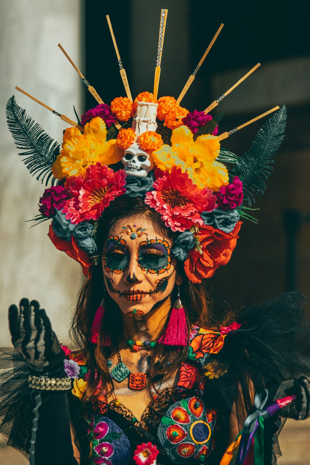 a woman in a costume with flowers on her head