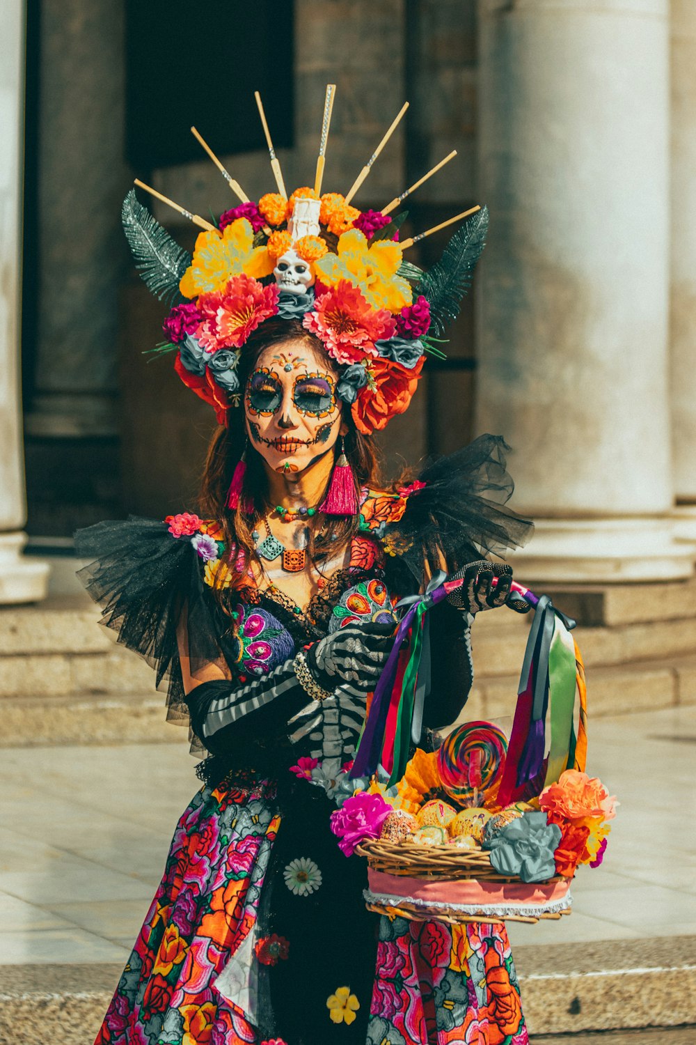a woman in a colorful costume holding a basket