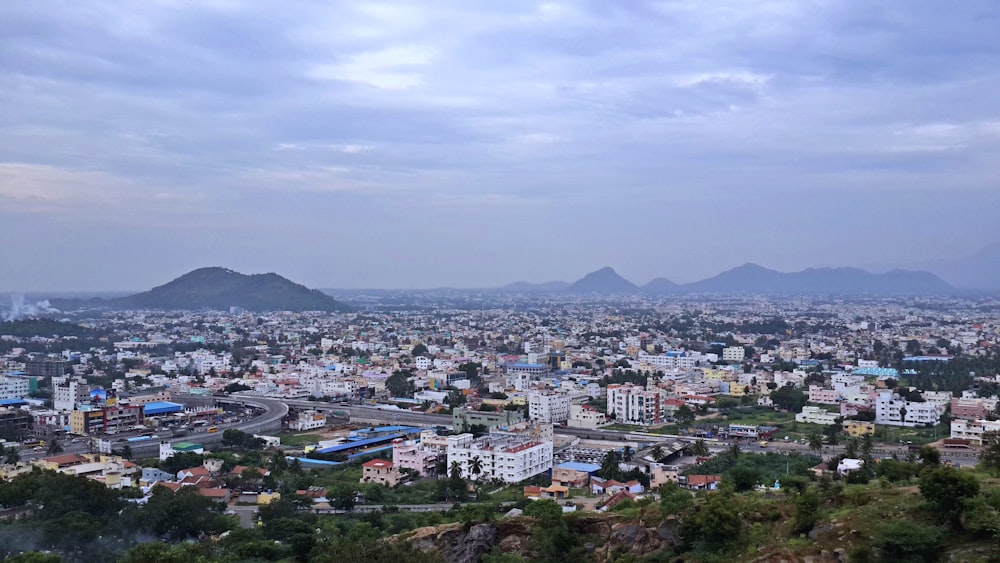 a view of a city with mountains in the background