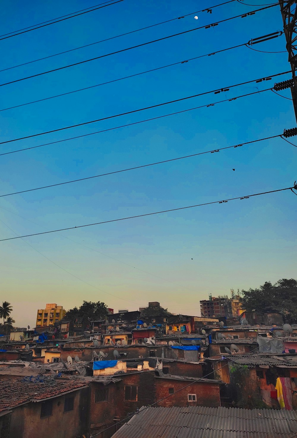 a view of a city with lots of power lines