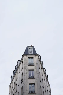 a tall building with a clock on the top of it