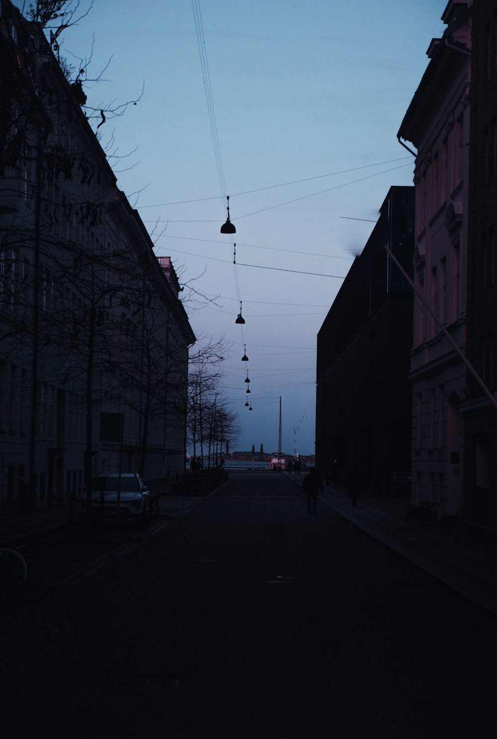 a person is walking down a dark street