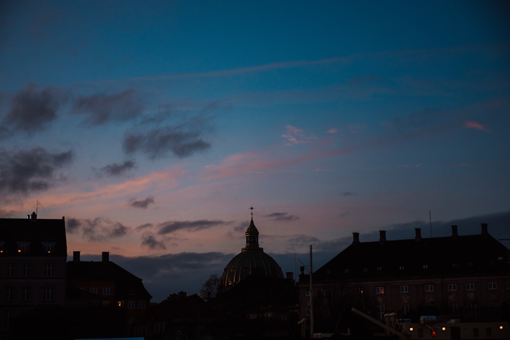 a view of a building with a dome at dusk