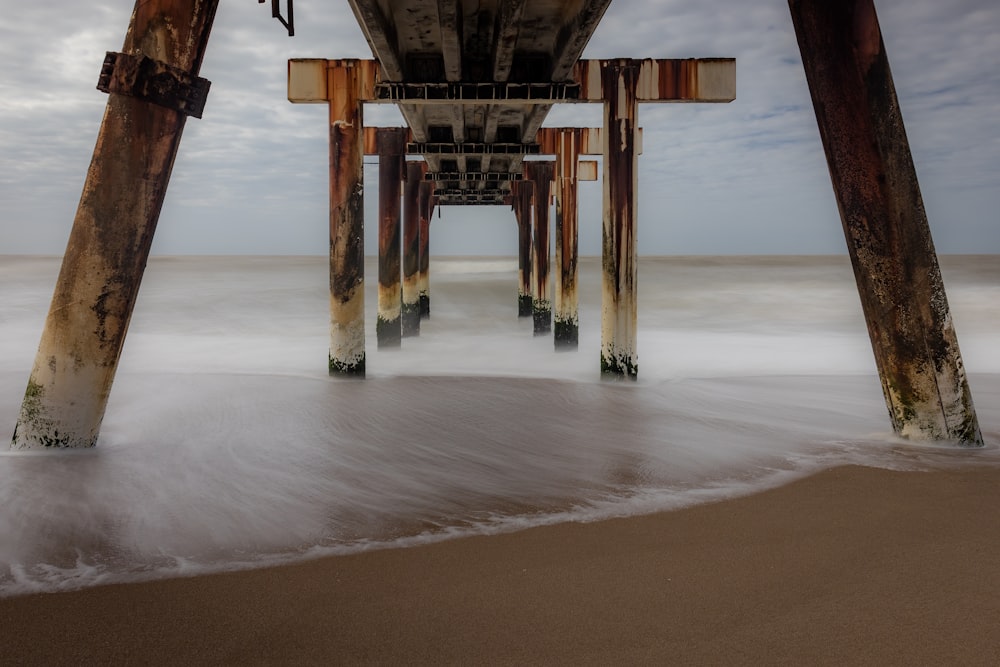a view of a pier from the beach
