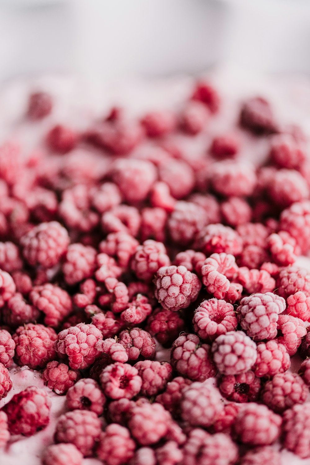 a close up of a bunch of raspberries