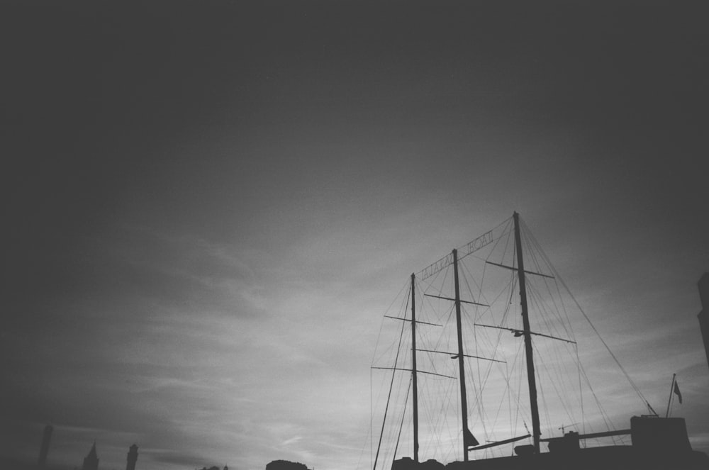 a black and white photo of a boat in the water