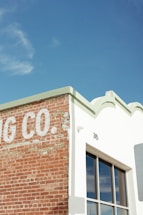 Photo of the storefront at 264 W 40th St, Midtown Manhattan, showing the roofing contractor's sign.