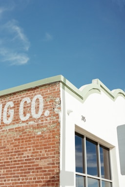 Photo of the storefront at 264 W 40th St, Midtown Manhattan, showing the roofing contractor's sign.