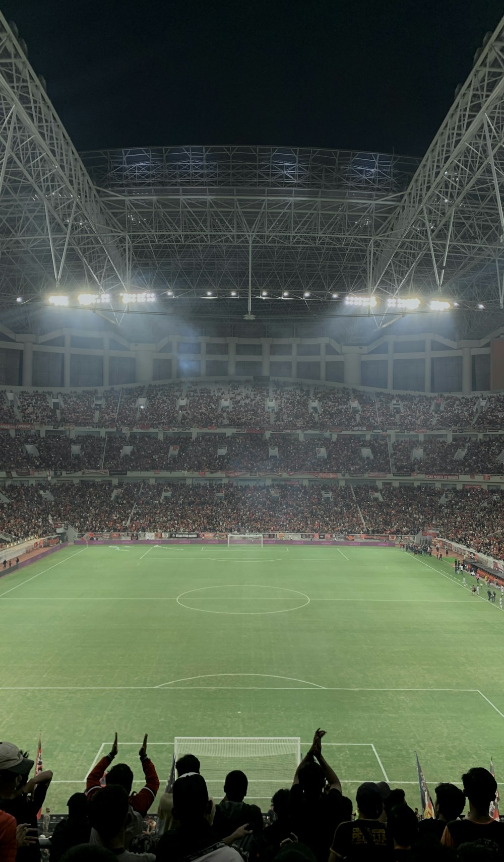 a stadium full of people watching a soccer game