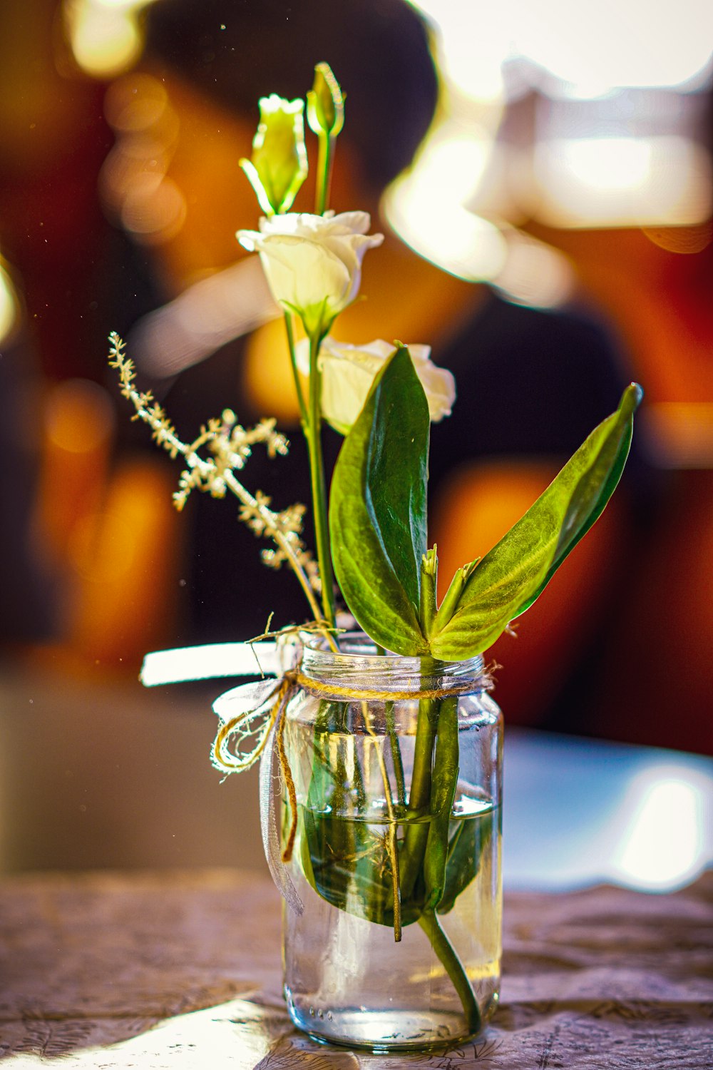 a vase filled with flowers on top of a table