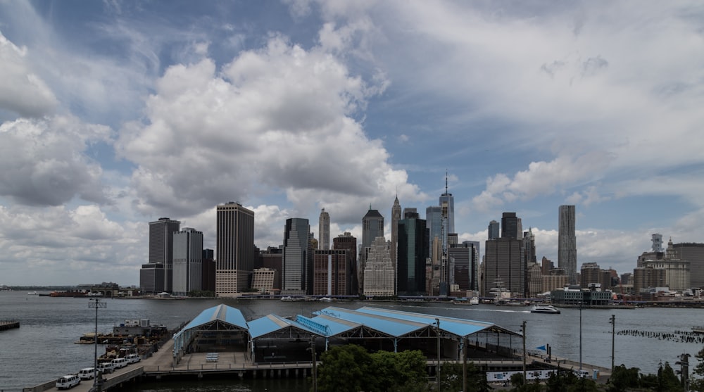 a view of a large city with a body of water in front of it