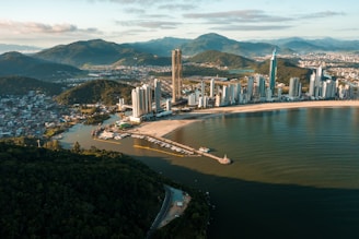 an aerial view of a city and a body of water