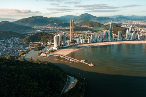 an aerial view of a city and a body of water