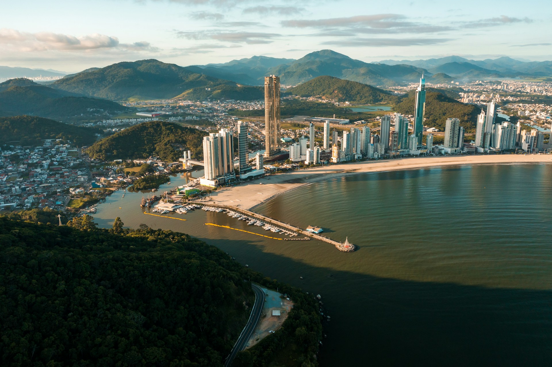 an aerial view of a city and a body of water